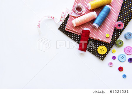 Sewing accessories on a white background Sewing accessories on a white background 65525581