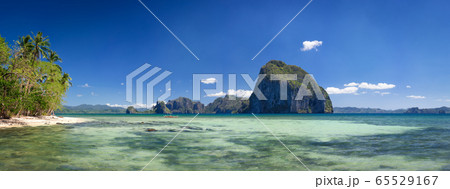 Palawan, Philippines. Tropical panorama view of El Nido coastline with huge rocky island on the background. National Marine Park 65529167