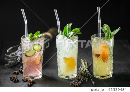 Refreshing fruit lemonade cocktails mint straws 65529484