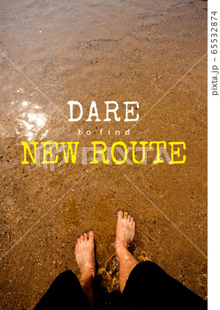 Man's feet on the sand in the river 65532874