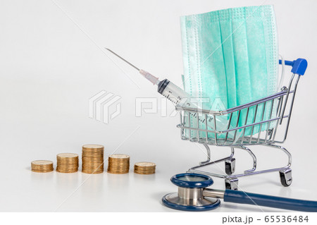 gold coins in a row with protective medical mask 65536484