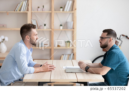 Side view young man applicant introduction himself to hr manager., Side view young man applicant introduction himself to hr manager., 65537202