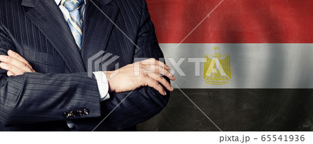 Crossed arms on Egyptian flag background, Crossed arms on Egyptian flag background, 65541936