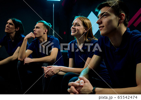 Young e-sports video gamers watching online presentation of new network game Young e-sports video gamers watching online presentation of new network game 65542474