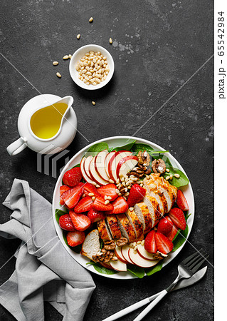 Grilled chicken breast and strawberry salad with Grilled chicken breast and strawberry salad with 65542984