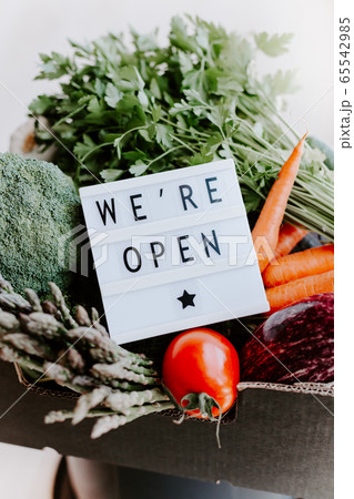Text We're open and Fresh green and vegetables box 65542985