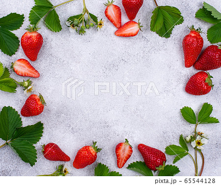 Strawberry with leaves and flowers Strawberry with leaves and flowers 65544128