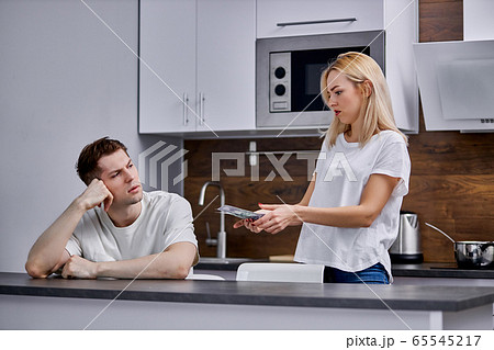young woman unhappy that man is constantly messing around 65545217