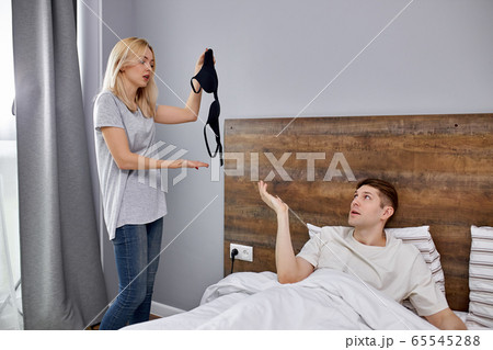man tries to make excuses to his wife, explains that he did not cheat on her man tries to make excuses to his wife, explains that he did not cheat on her 65545288