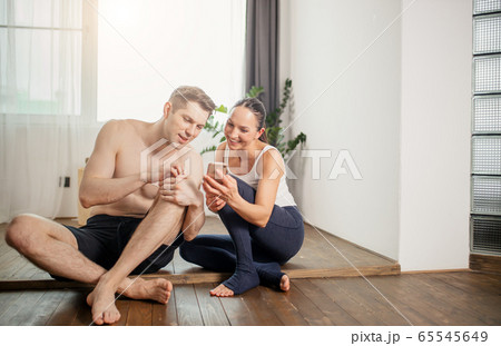 happy caucasian couple have rest after yoga exercises 65545649