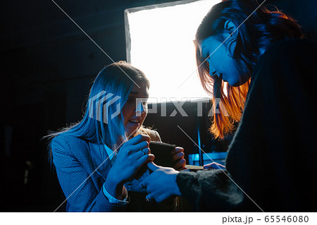 Woman and woman fortune teller with crystal ball 65546080
