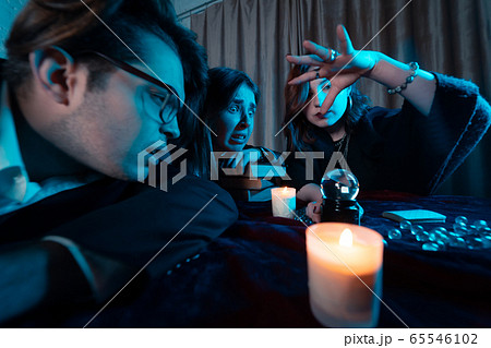 Group of people and woman fortune teller with crystal ball Group of people and woman fortune teller with crystal ball 65546102