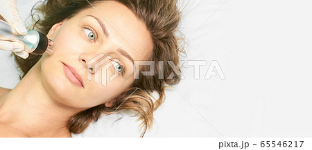 Dermatology skin care facial therapy. Medical spa anto wrinkles procedure. Woman 65546217