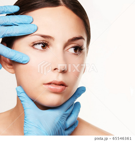 Facelift hydra treats. Esthetic skin care analysis. Doctor hands in gloves. 65546361
