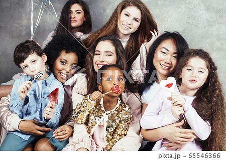 Lifestyle and people concept: young pretty diversity nations woman with different age children celebrating on birth day party together happy smiling, making selfie. African-american, asian and 65546366