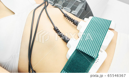 Laser lipo equipment. Cosmetic fat reduce treatment. Woman in medicine salon. Anti cellulite procedure Laser lipo equipment. Cosmetic fat reduce treatment. Woman in medicine salon. Anti cellulite procedure 65546367