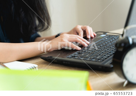 Close up hands of a woman typing the keyboard during work from home. Female programmers are programming, documenting, email, or chating in lifestyle and new normal concept with copy space Close up hands of a woman typing the keyboard during work from home. Female programmers are programming, documenting, email, or chating in lifestyle and new normal concept with copy space 65553723