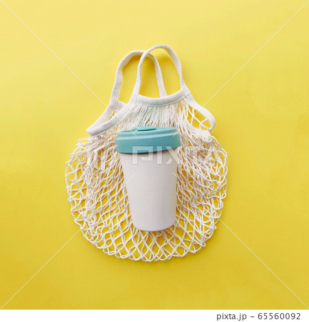 Reusable eco friendly cotton net bag and bamboo cup. Reusable eco friendly cotton net bag and bamboo cup. 65560092