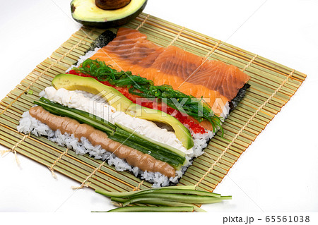 Group of fresh rolled sushi on bamboo sushi mat Stock Photo - Alamy