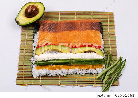 Making Rolled Sushi In A Bamboo Sushi Mat Stock Photo, Picture and Royalty  Free Image. Image 159721542.