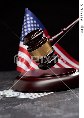 Wooden gavel, money on background of American flag on black background . Wooden gavel, money on background of American flag on black background . 65561815