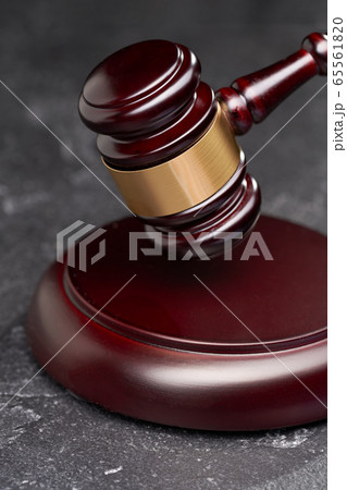 Symbol of court and justice, judge's hammer on black background 65561820