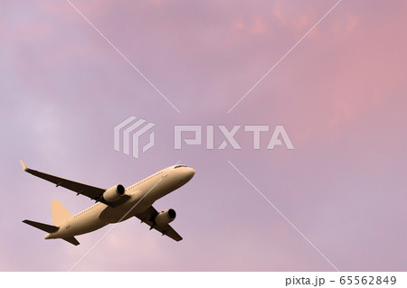 passenger plane takes off in a beautiful sunset passenger plane takes off in a beautiful sunset 65562849