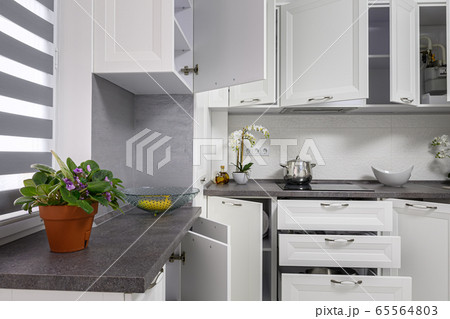 Minimalistic modern white kitchen interior details 65564803
