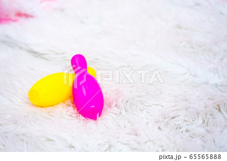 Colorful plastic bowling ball on the carpet Colorful plastic bowling ball on the carpet 65565888