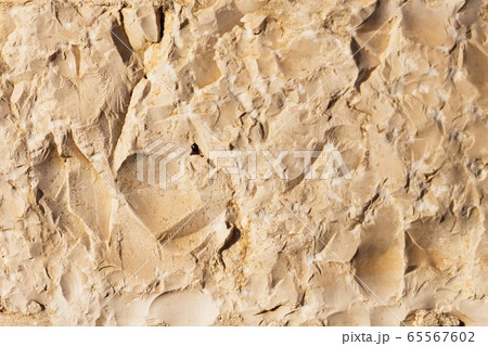 Wall sandstone texture background. Yellow old grunge surface, stone vintage texture. Voluminous background 65567602
