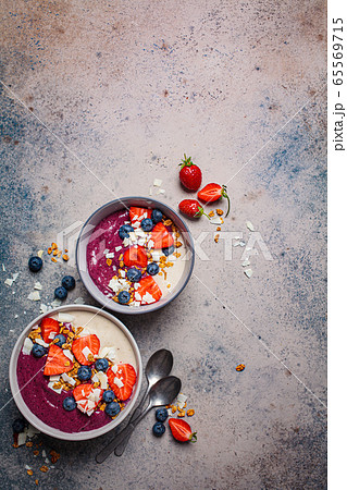 Berry smoothie bowl with granola, berries  65569715