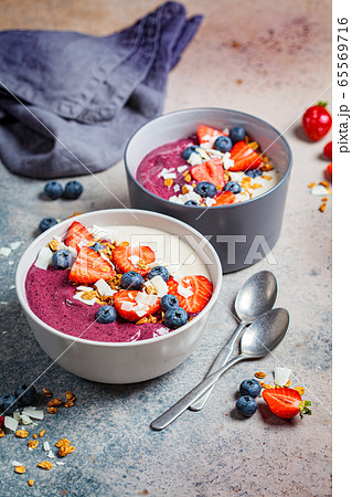 Berry smoothie bowl with granola, strawberry 65569716