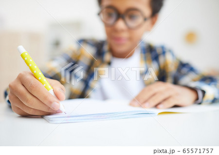African Boy Doing Homework African Boy Doing Homework 65571757