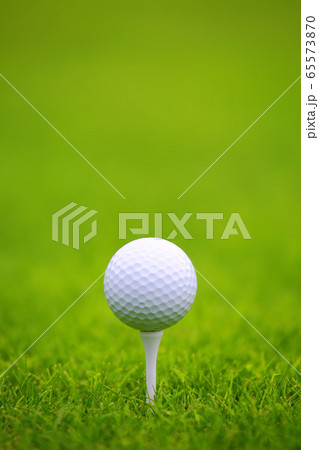 Golf ball on green grass background Golf ball on green grass background 65573870
