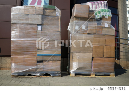 Huge pile of cardboard boxes packed together with stretch tape Huge pile of cardboard boxes packed together with stretch tape 65574331