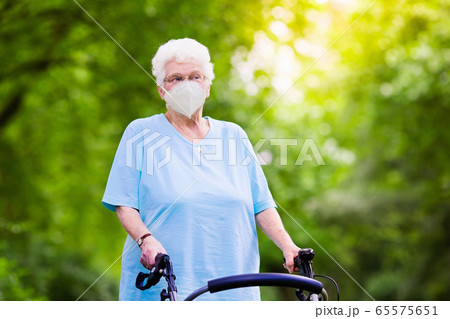 Senior woman in face mask. Virus outbreak. 65575651