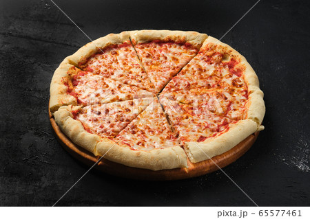 Cheese pizza cut in slices Cheese pizza cut in slices 65577461