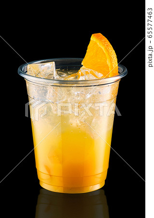 Cold fizz cocktail with orange in take away cup Cold fizz cocktail with orange in take away cup 65577463