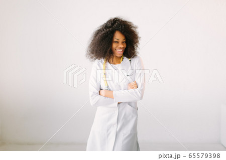 Black nurse isolated at the hospital. Happy African American trusted Doctor Woman isolated on white background Black nurse isolated at the hospital. Happy African American trusted Doctor Woman isolated on white background 65579398
