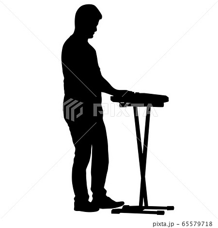 Silhouette musician plays the synthesizer on a 65579718