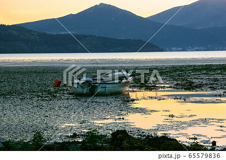 Fishing boat with a motor on Lake Orestiada in Fishing boat with a motor on Lake Orestiada in 65579836