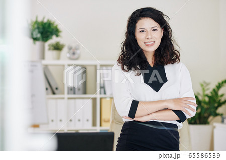 Cheerful young business lady Cheerful young business lady 65586539
