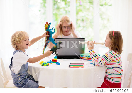 Mother working from home with kids. Quarantine. Mother working from home with kids. Quarantine. 65590308