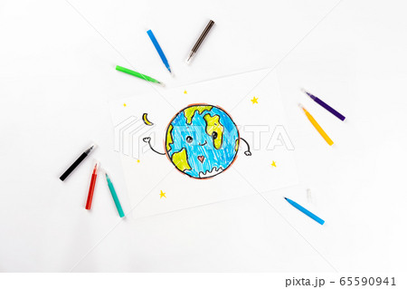 Children's drawing of our planet on a white sheet of paper. Children's drawing of our planet on a white sheet of paper. 65590941