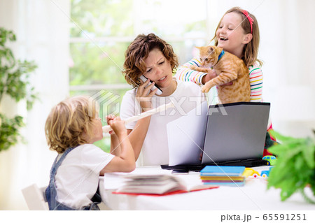 Mother working from home with kids. Quarantine. Mother working from home with kids. Quarantine. 65591251