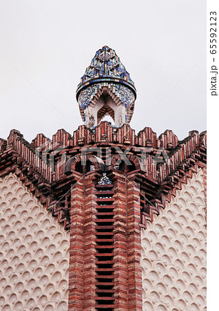 Red brick ornate vintage wall of Pavilion Guell in Barcelona 65592123
