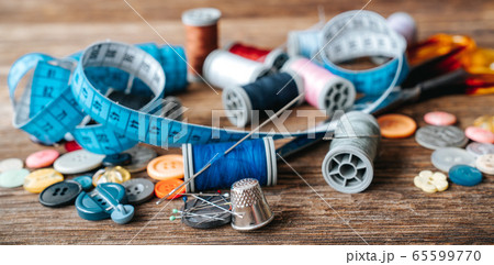 Group of objects about Sewing equipment set on a wooden background. Sewing and tailoring concept. 65599770