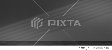 Empty room with a black modern wall shadow light overlay for minimal concept. 65600730