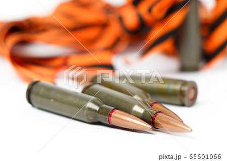 Cartridges lie on the background of the St. George ribbon. 65601066