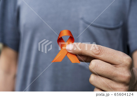 orange ribbon in support of multiple sclerosis 65604124